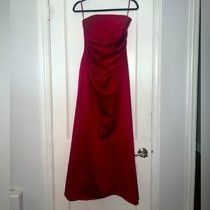 Size 4 red satin strapless gown. Side ruching detail.
